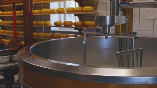 Process of cheesemaking with rotating mixer closeup — Stockvideo