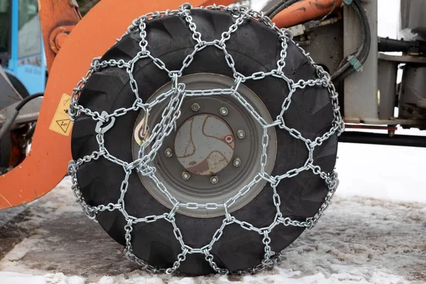 Snow chains on large industrial trch wheels