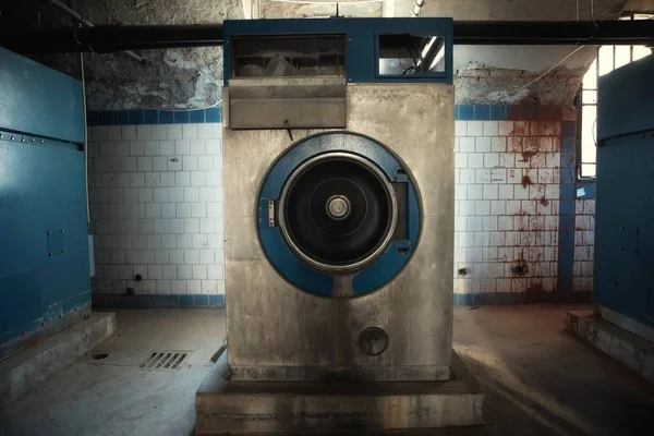 Old industrial washing machine in the basement — Stock Photo, Image