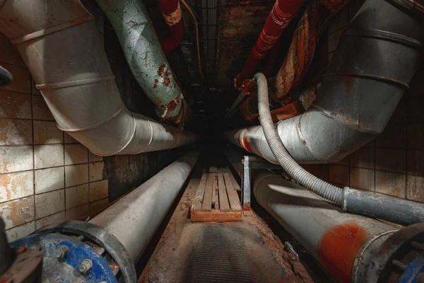 Dark underground tunnel made out of pipes — Stock Photo, Image