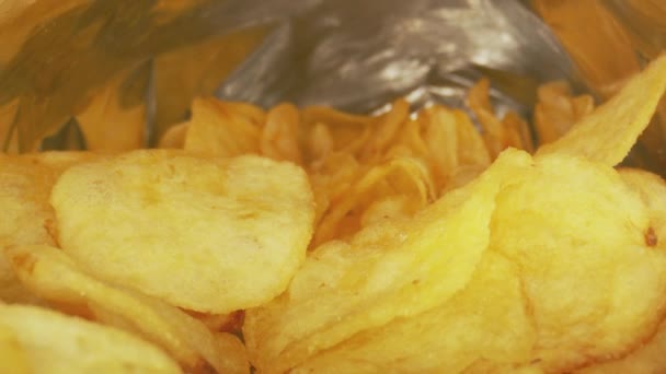 Potato chips in camera motion closeup footage — Stock Video
