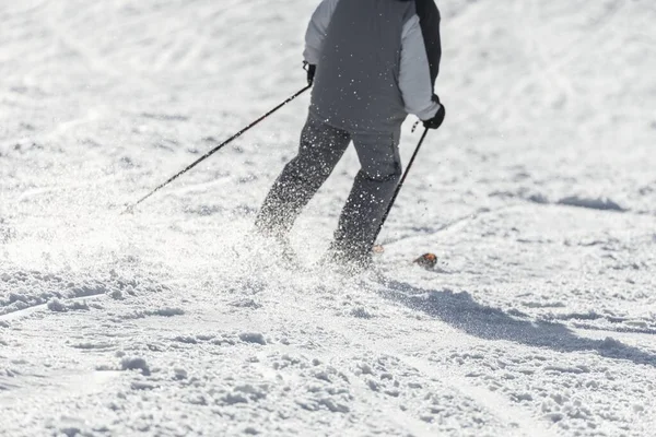 Skier sliding down on hillside — Stock Photo, Image