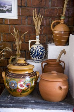 Traditional Romanian earthenware pottery in Buzau - Romania. Romanian pottery is traditionally produced by hand. clipart