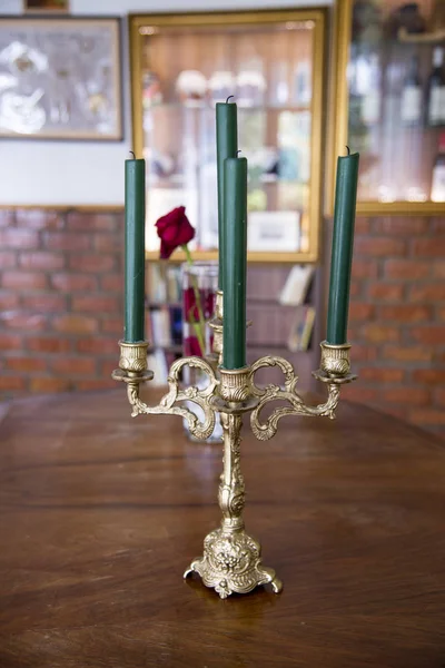 Old metal candle holder with candles