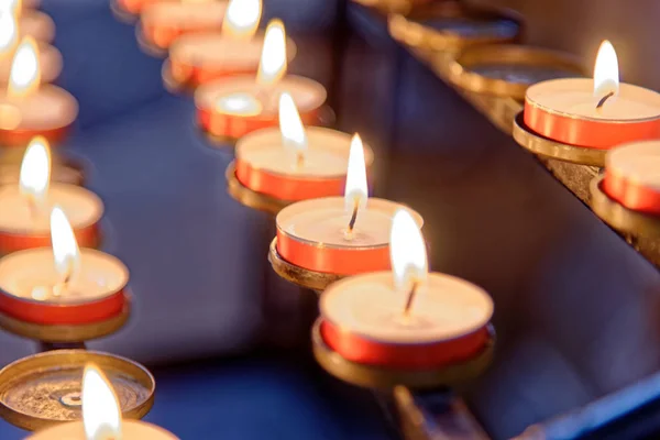 Burning candles inside Winchester Cathedral, Hampshire, England