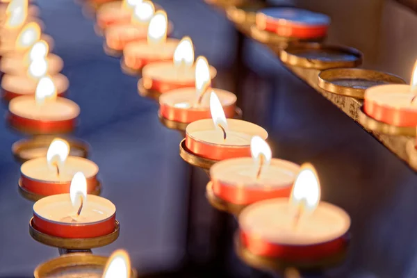 Burning candles inside Winchester Cathedral, Hampshire, England