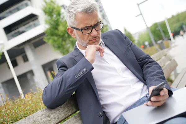 Businessman Sitting Public Bench Using Smartphone — Stock Photo, Image