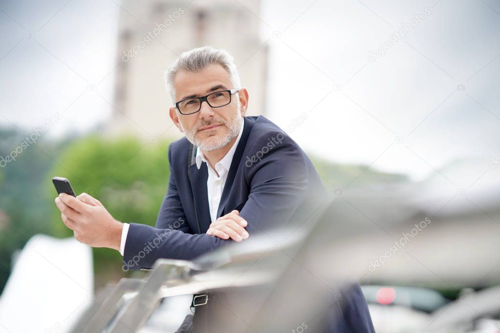 Businessman in town waiting for meeting
