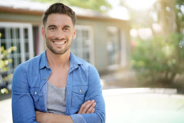 Portrait of 40-year-old man relaxing outside