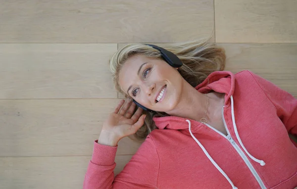 Upper view of woman listening to music with wifi headset
