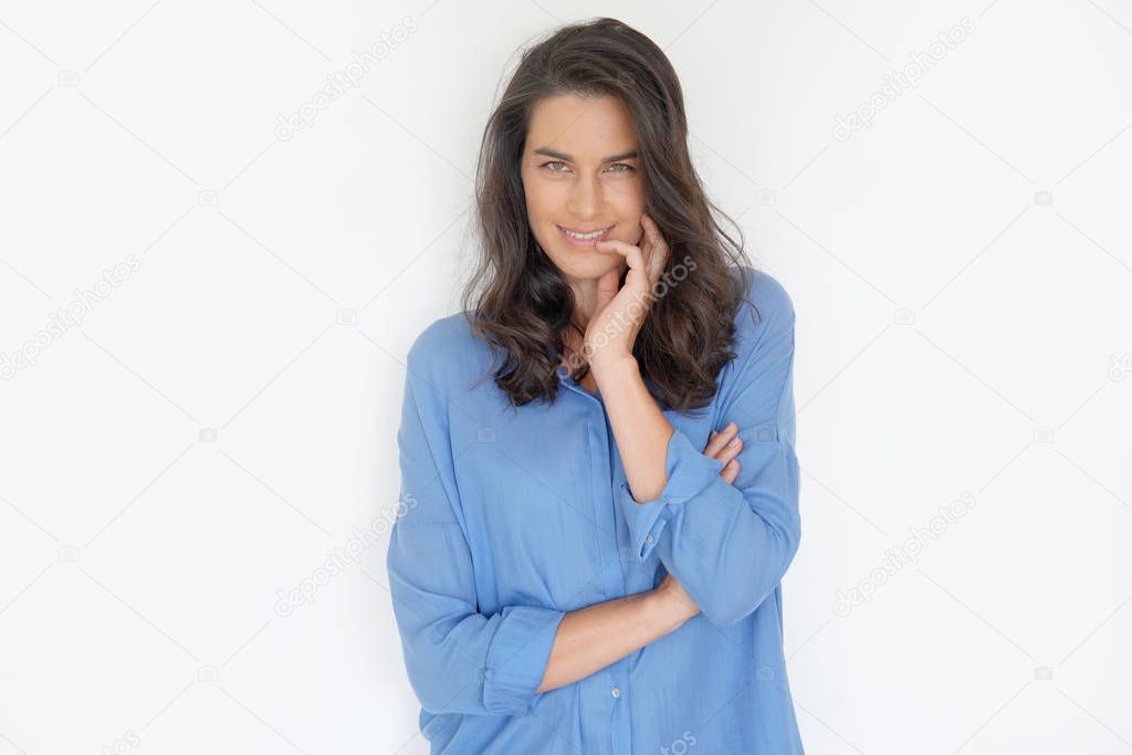 Brunette woman standing on white background, isolated