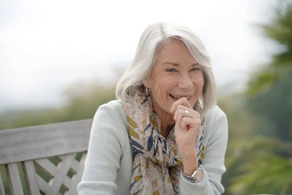 Beautiful Senior Womam Sitting Outdoors Looking Peaceful — Stock Photo, Image