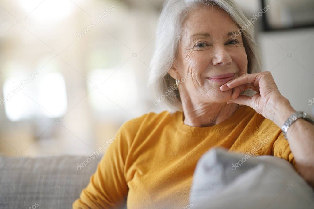   Beautiful senior woman relaxing at home                        