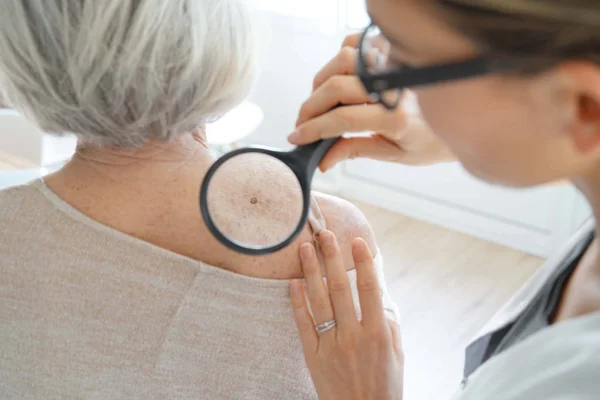 Senior Woman Getting Skin Checked Dermatologist — Stock Photo, Image