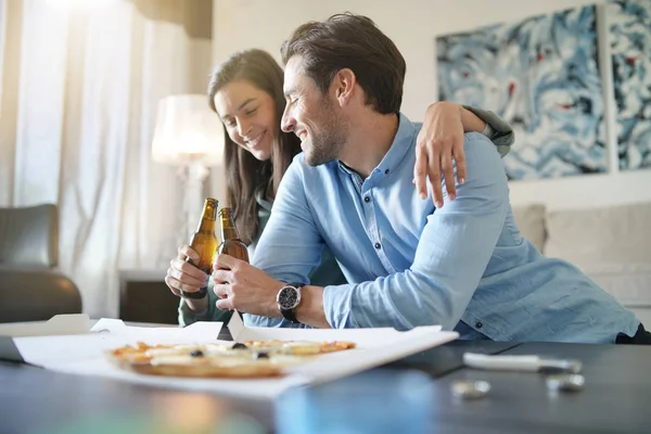 Happy Relaxed Couple Sharing Pizza Home — Stok Foto