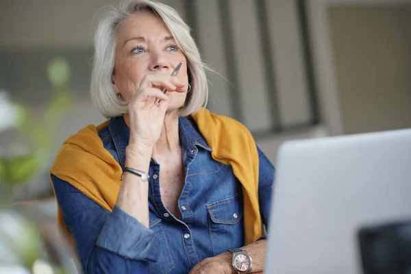 Attractive Senior Woman Thinking Working Home — Stock Photo, Image
