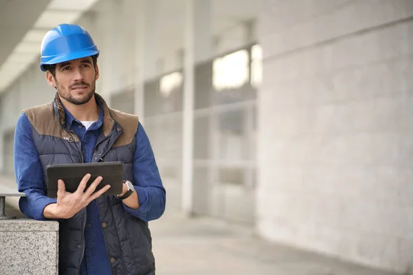 Attractive Building Expert Hardhat Checking Sight Tablet — Stock Photo, Image