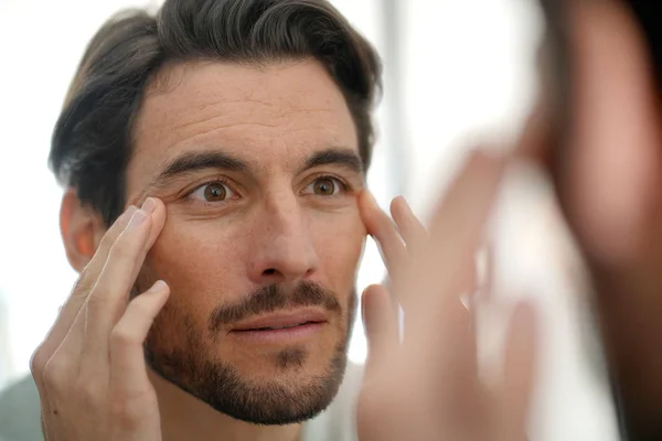 Handsome Man Checking Wrinkles Mirror Home — Stock Photo, Image