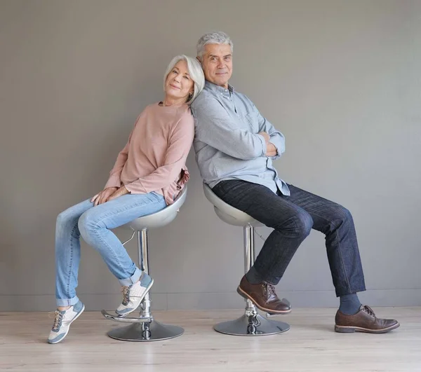 Happy Senior Couple Sitting Bar Stools Grey Backgound — Stock Photo, Image