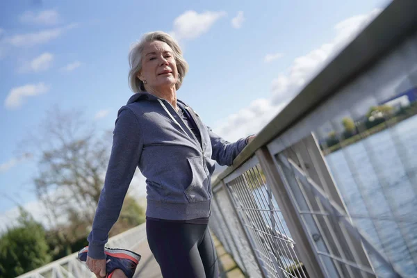 Mujer Mayor Flexible Estirándose Aire Libre Después Trotar —  Fotos de Stock