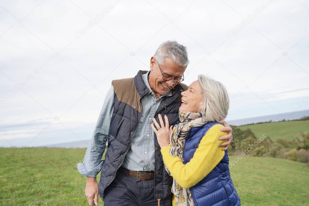  Healthy senior couple on countryside walk                              