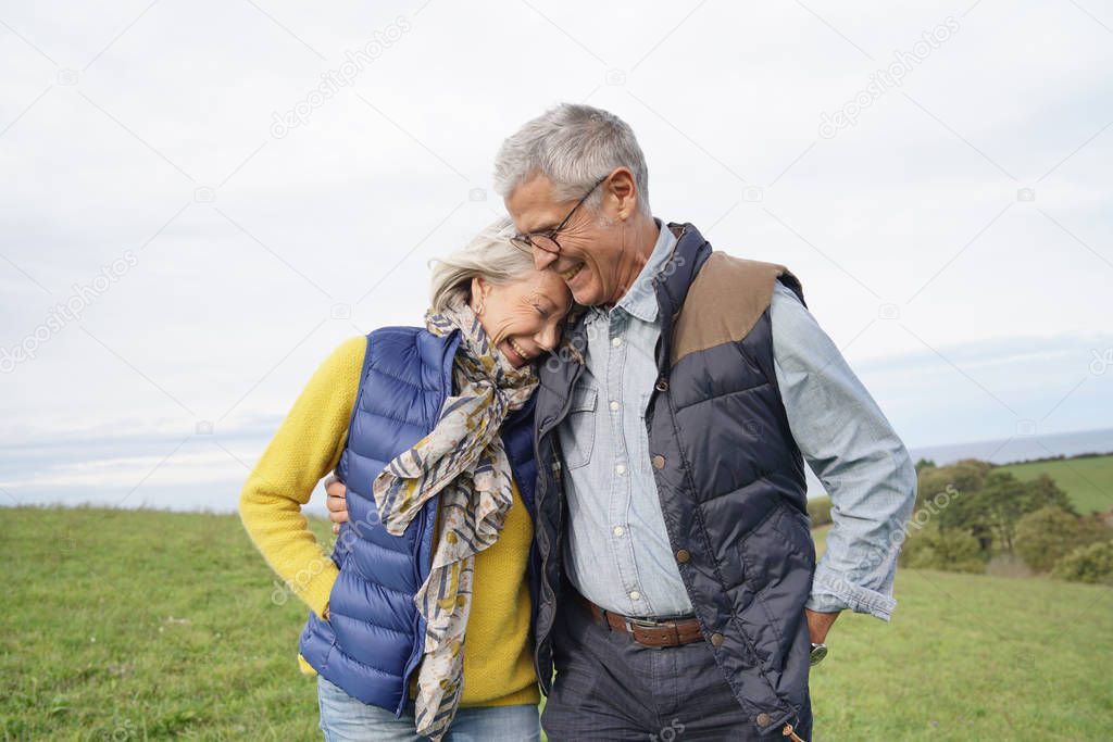  Healthy senior couple on countryside walk                              