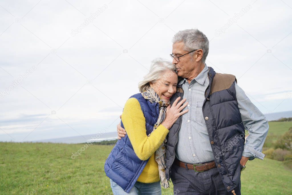  Healthy senior couple on countryside walk                              