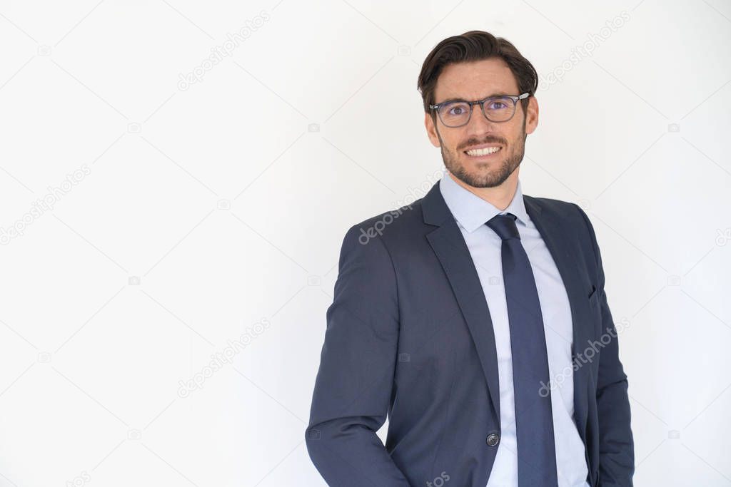 Isolated handsome businessman smiling in tailored suit