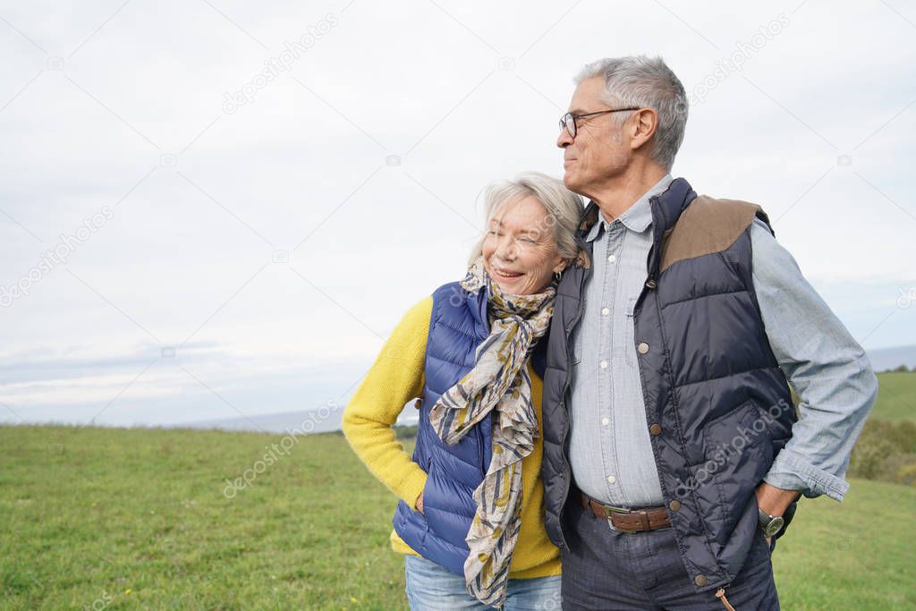  Healthy senior couple on countryside walk                              