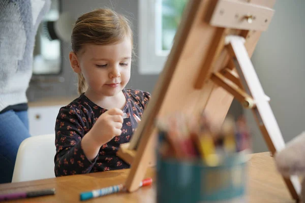 Young Girl Drawing Herself Easel Home — 스톡 사진