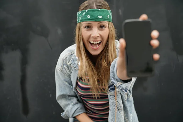Dynamic Happy Young Student Showing Cellphone Black Background — Stock Photo, Image