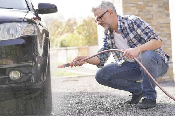 Mature Man Washing His Car Driveway — Stock Photo, Image