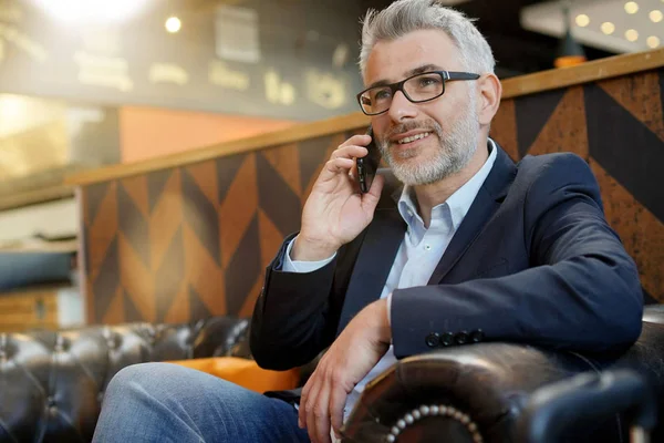 Relaxed Businessman Talking Cellphone Royalty Free Stock Images