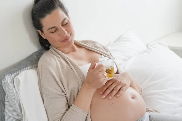 Pregnant Woman Laying Bed Drinking Infusion — Stock Photo, Image