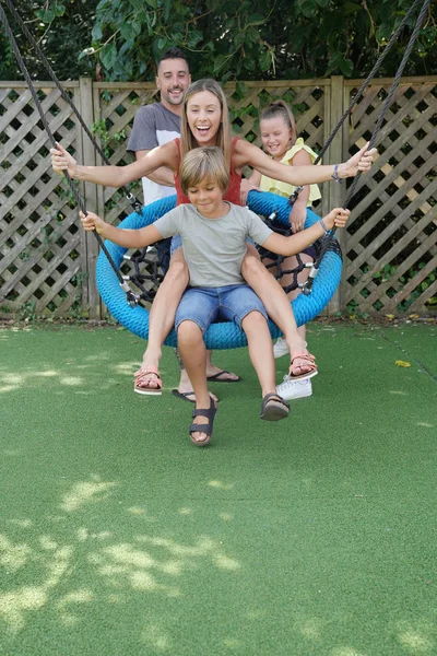 Family Playing Swing Park — Stock Photo, Image