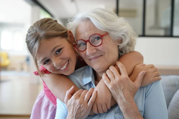 Portrait of smiling grandmother with grandkid