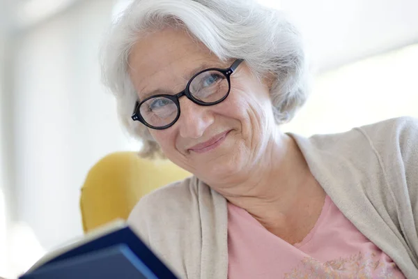 Senior Woman Relaxing Armchair Reading Book — Stock Photo, Image