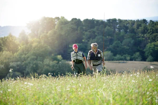 Father Son Returning Fly Fishing Trip Walking Meadow — Stock Photo, Image