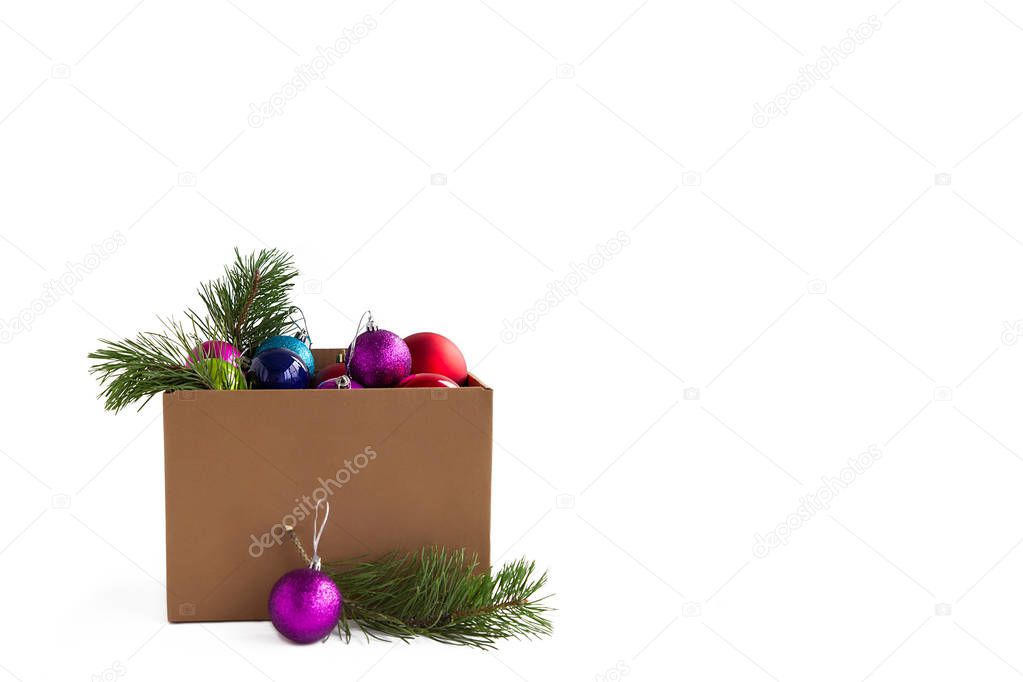 Large box with colorful Christmas balls decorations on white isolated background.Preparing for the new year and Christmas