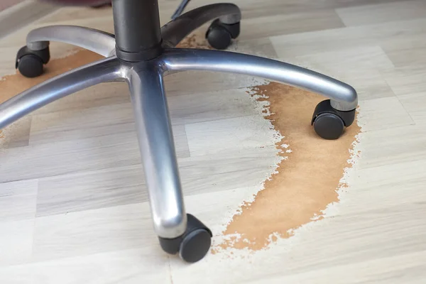 Damaged Laminate Floor from office chair wheel Stock Picture