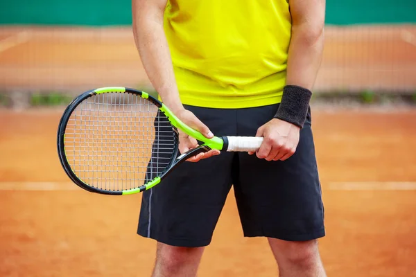 Midsection of male tennis player holding the racket. — Stock Photo, Image