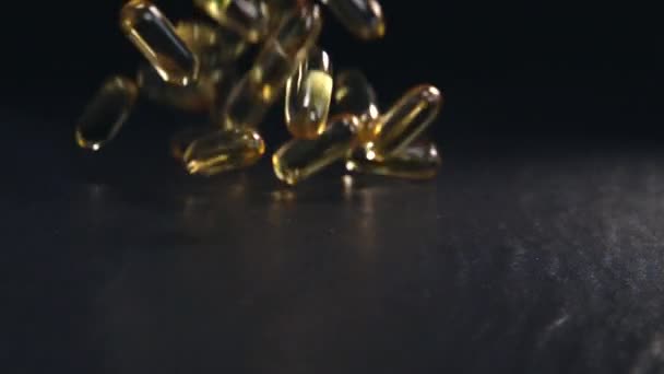 Omega 3 pils of capsules in slow motion — Stockvideo