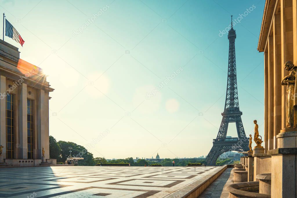 Paris streets with view on the famous Paris eiffel tower on a sunny day with sunshine