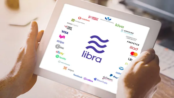 Libra and 27 membership organizations logos on tablet pc — Stock Photo, Image