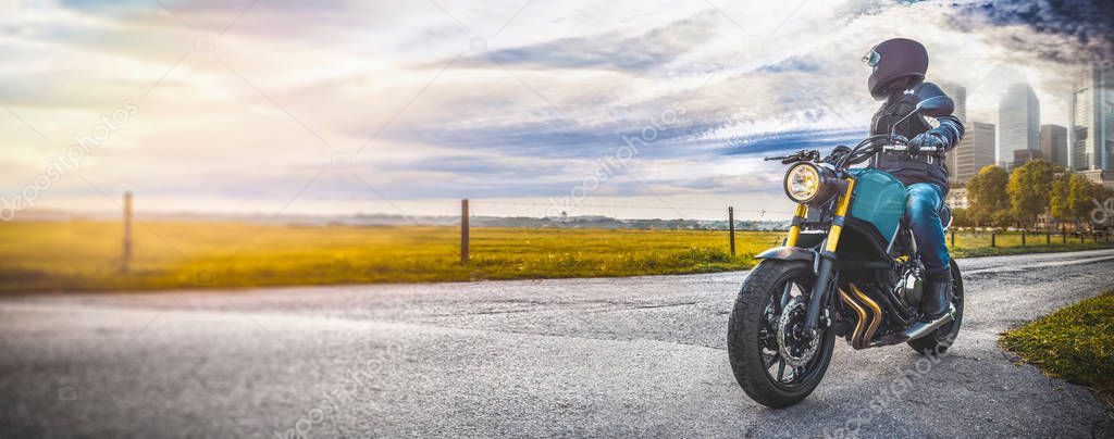 man on motorbike having fun driving the empty road 