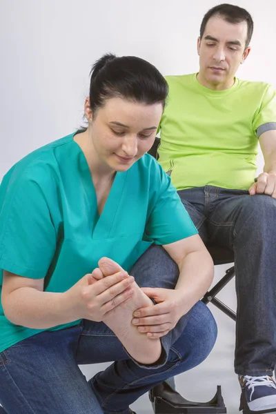 Female Physiotherapist Massaging Foot Young Man Wheelchair People Healthy Care — Stock Photo, Image