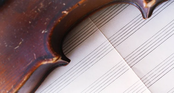 Beautiful old violin and note paper