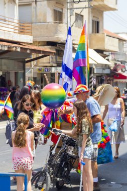 Tel Aviv, Israel - June 8, 2018: 20th annual Tel Aviv Pride Week.At the parade, people walking, dancing, singing, waving banners and rainbow flags celebrating the largest LGBT event in the middle east clipart