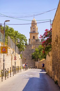 Jerusalem, Israel - June 14, 2018: Ancient streets and buildings in the old city of Jerusalem. Jerusalem is the holy land to the Abrahamic religions; Judaism, Christianity and Islam. clipart