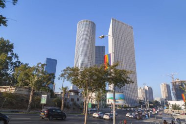 Tel Aviv, Israel - June 9, 2018: Exterior view of the Azrieli Center, three business towers in different shapes located between Ayalon Highway, Hashalom and Kaplan Streets, Tel Aviv. clipart